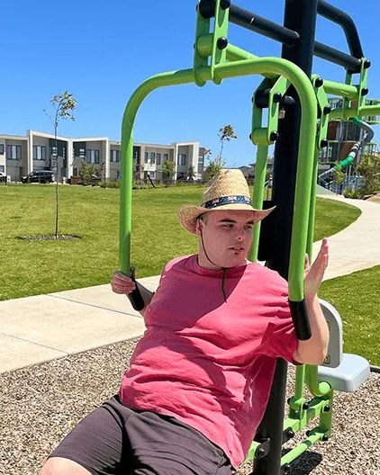 Special Care Australia participant using outdoor exercise equipment